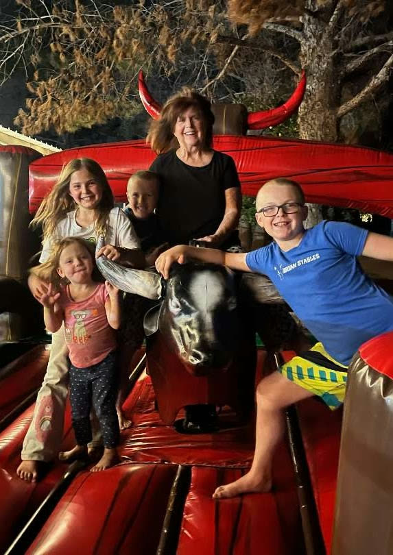 Grammy Jordan with her grandchildren at the barn